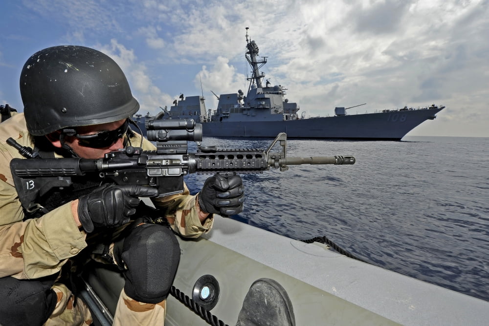 A soldier provides security in a rigid hull inflatable boat during a training exercise Canvas Art - Stocktrek Images (35 x 24)