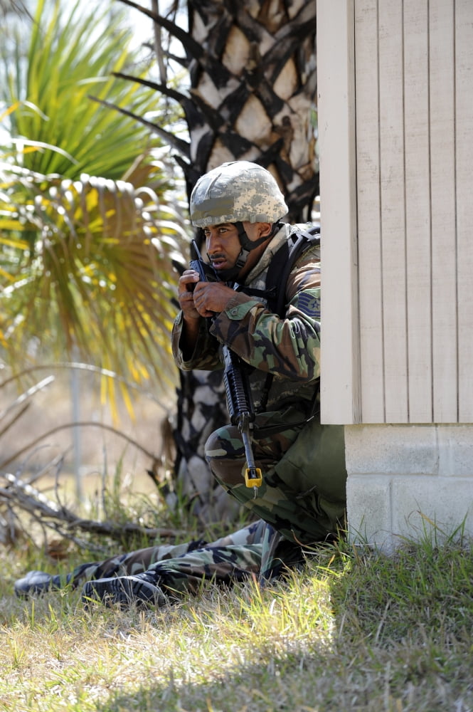 A soldier radios in a casualty report Canvas Art - Stocktrek Images (23 x 34)