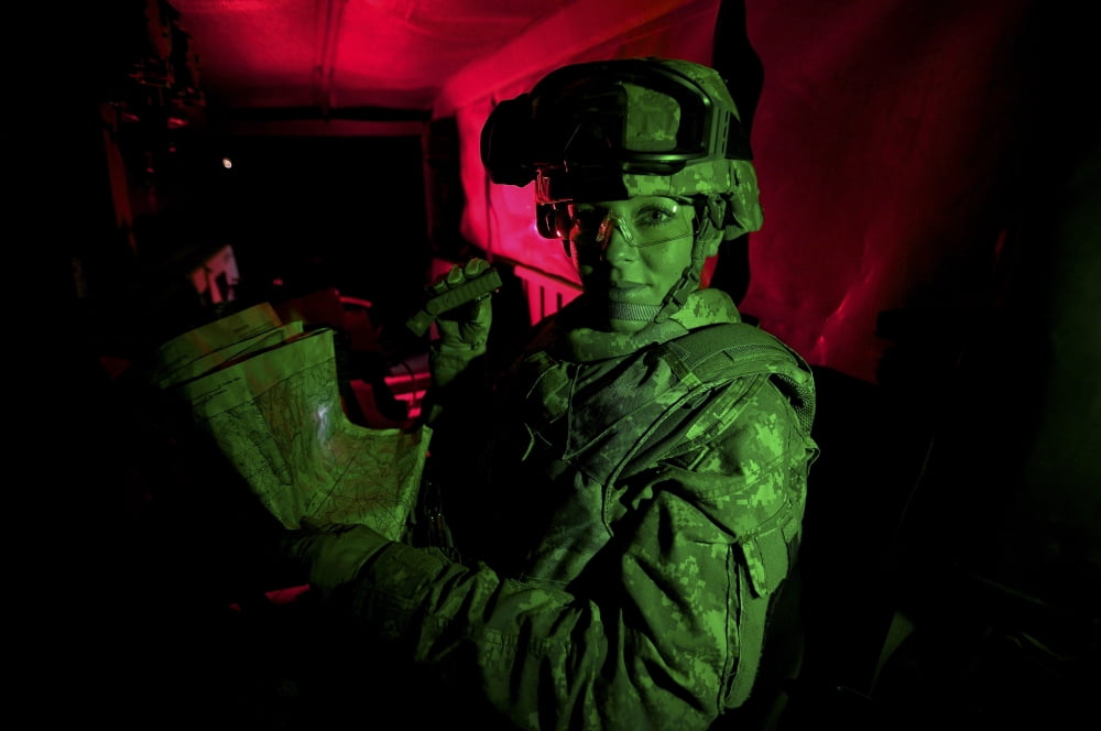 A soldier reads a map at night under a green light Canvas Art - Terry MooreStocktrek Images (18 x 12)