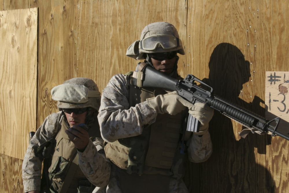 A soldier shows his partner a dummy grenade that he is about to throw into a room Canvas Art - Stocktrek Images (34 x 23)