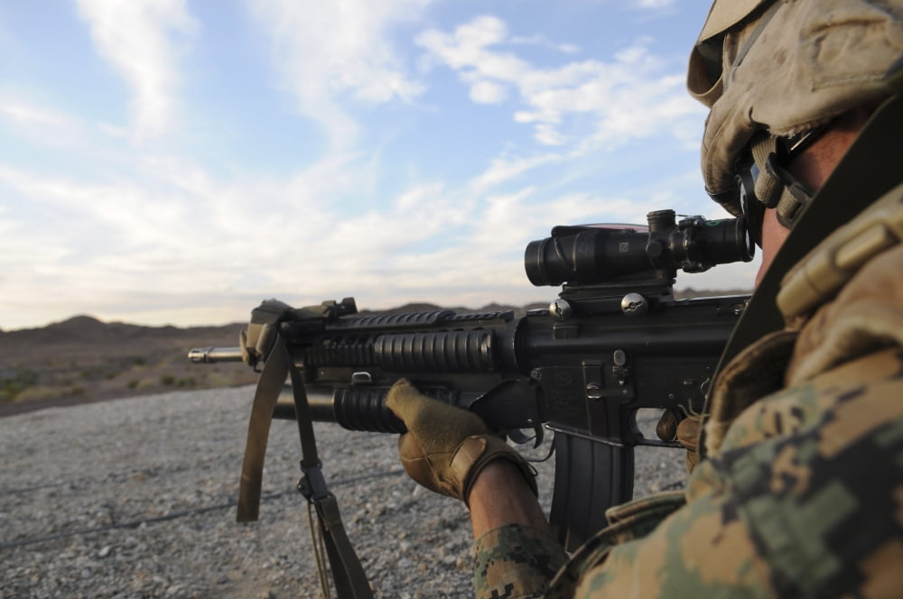 A soldier sights in to fire on a target on a shooting range Canvas Art - Stocktrek Images (35 x 23)