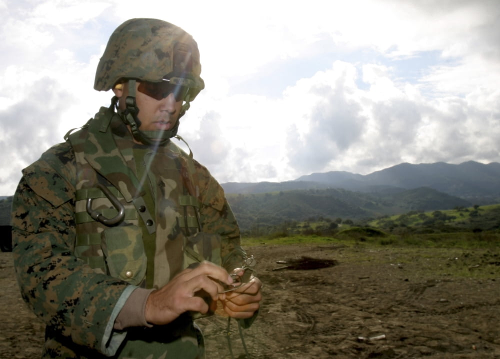 A squad leader prepares a time fuse for a Bangalore Torpedo Canvas Art - Stocktrek Images (33 x 24)