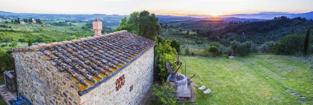A stone house and a view of the lush landscape at sunset Villa Capanuccia Florence Italy Canvas Art - Brian Guzzetti Design Pics (44 x 15)
