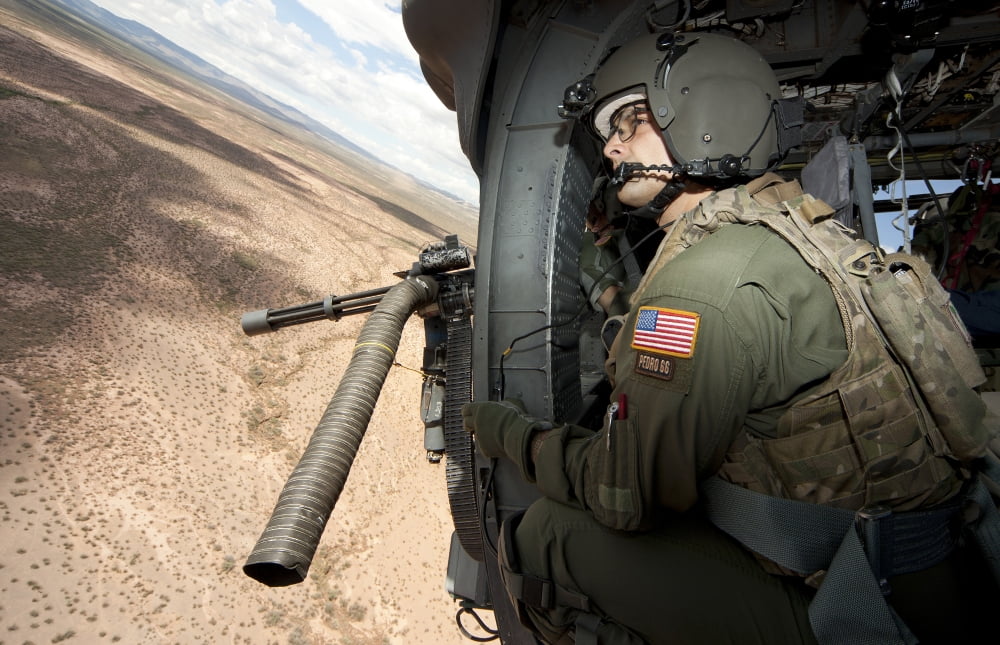 A student learns the art of aerial gunnery in an HH-60G Pave Hawk Canvas Art - Erik RoelofsStocktrek Images (18 x 12)
