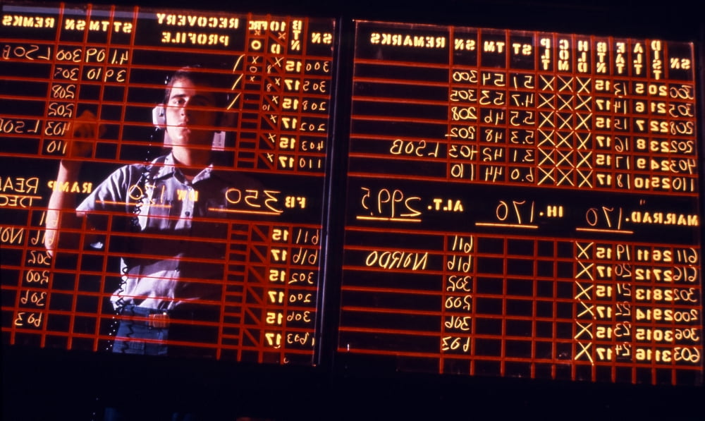 A student learns to write backwards on the air traffic control room status board Canvas Art - Michael WoodStocktrek Images (18 x 11)