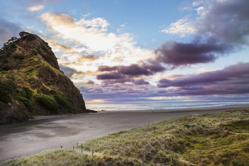 A sunset at the surf beach of Piha just outside of Auckland New Zealand Canvas Art - Micah Wright Design Pics (19 x 12)