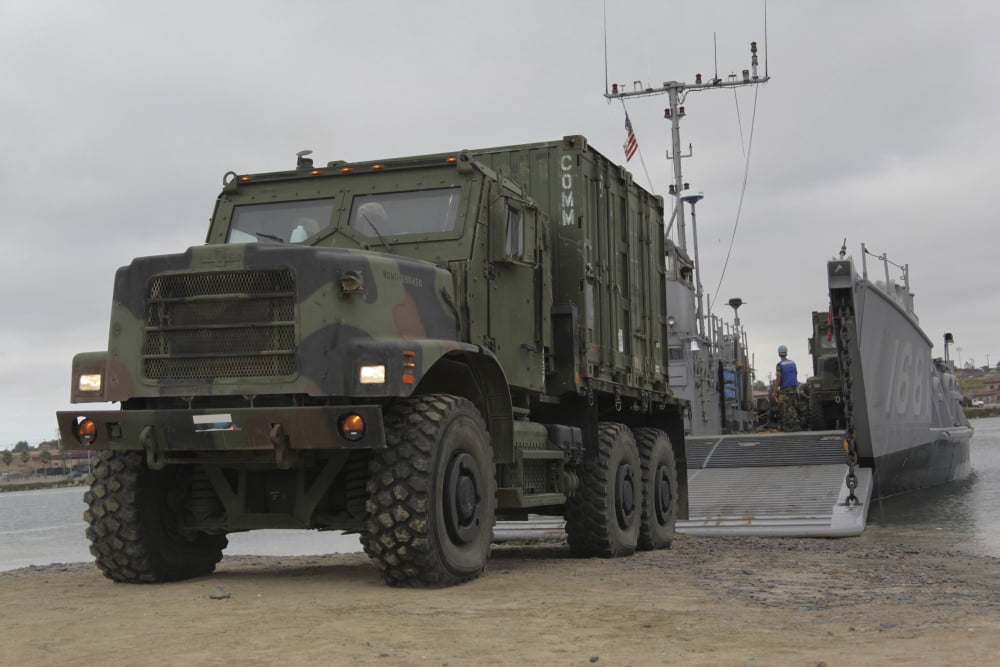 A tactical vehicle is off-loaded from a landing craft utility Canvas Art - Stocktrek Images (35 x 23)