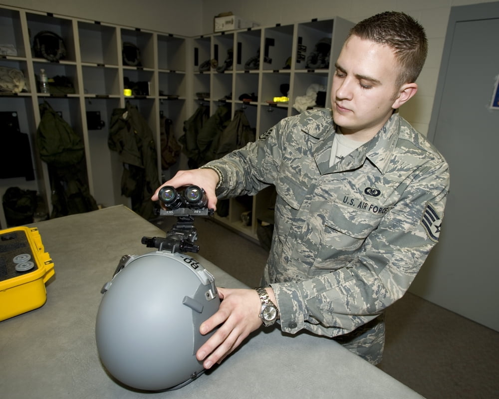 A technician works on a pair of night vision goggles Canvas Art - HIGH-G ProductionsStocktrek Images (32 x 26)