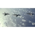 thumbnail image 1 of A three-ship formation of F-22 Raptors fly over the Pacific Ocean Poster Print, 1 of 2