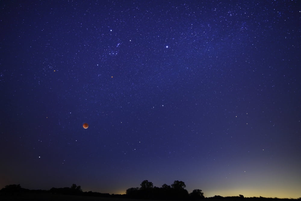 A wide field composite showing the moon against the stars Canvas Art - Luis ArgerichStocktrek Images (17 x 12)