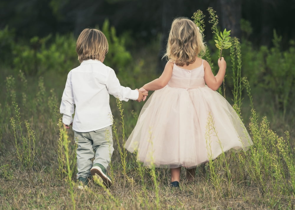 A young boy and young girl holding hands and walking through a field Tarifa Cadiz Andalusia Spain Canvas Art - Ben Welsh Design Pics (18 x 13)