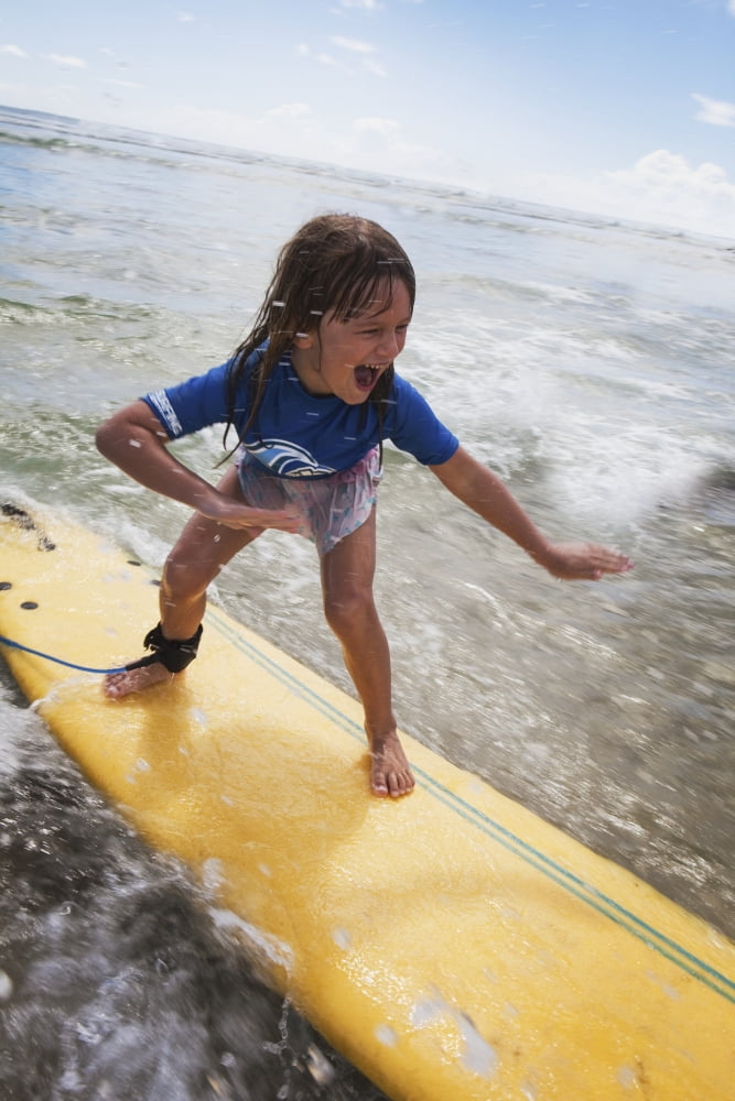 A young girl on a yellow surfboardGold coast queensland australia Canvas Art - Marcos Welsh Design Pics (24 x 38)