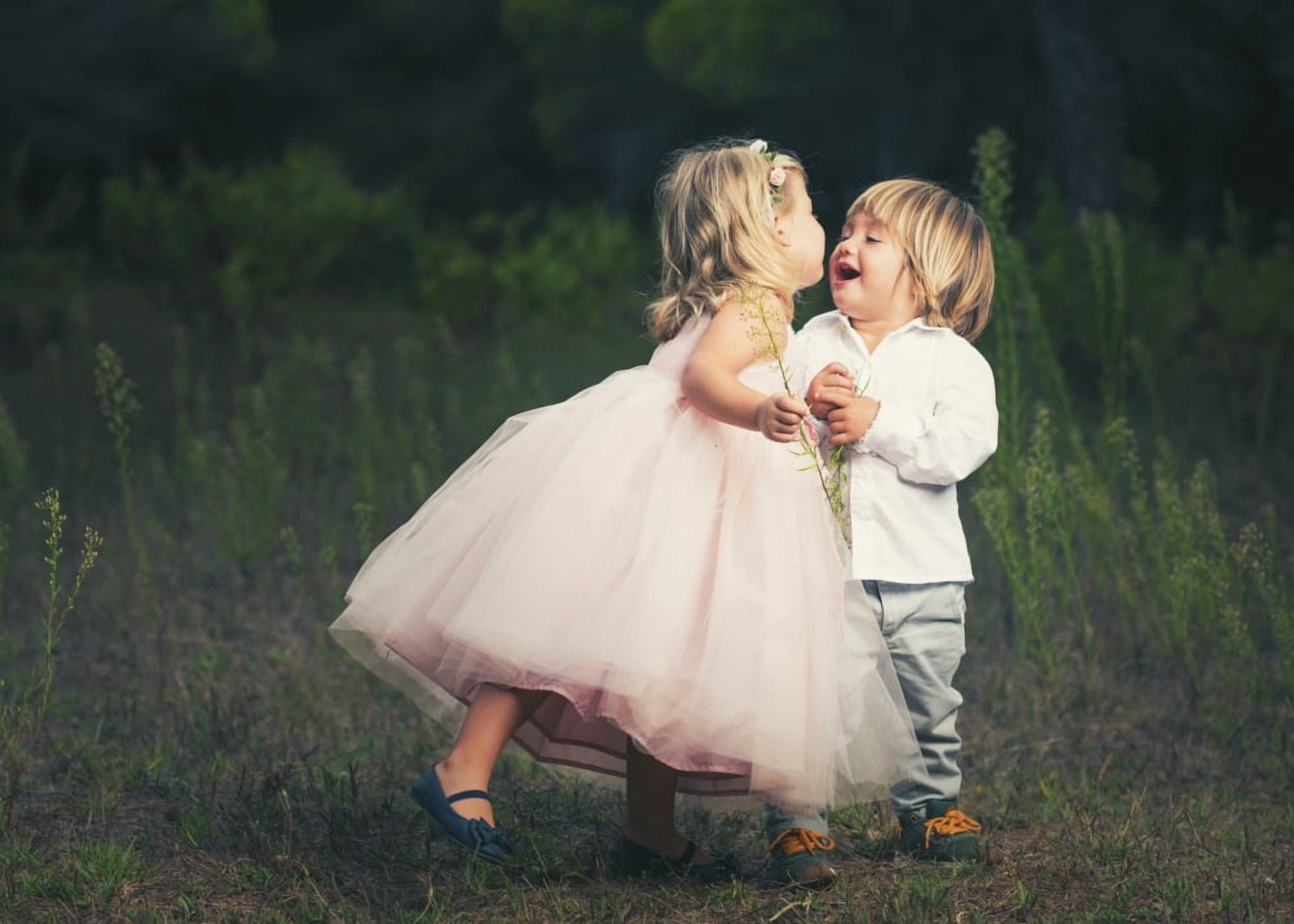 A young girl with a pink princess dress leans in to kiss a young boy Tarifa Cadiz Andalusia Spain Canvas Art - Ben Welsh Design Pics (18 x 13)