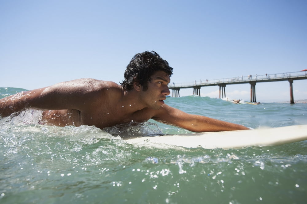 A young man paddling on a surfboard Hawaii United States of America Canvas Art - Mike Raabe Design Pics (38 x 24)
