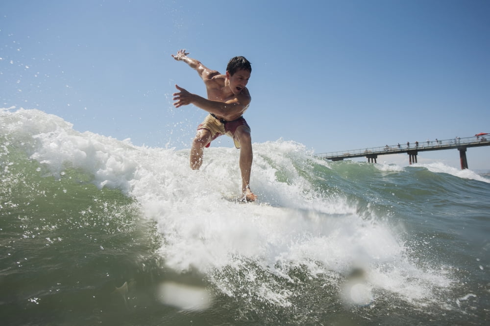 A young man surfing on a wave Hawaii United States of America Canvas Art - Mike Raabe Design Pics (19 x 12)