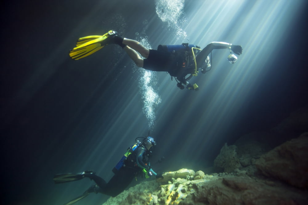 A young married couple scuba diving in Devils Den Springs Florida Canvas Art - Michael WoodStocktrek Images (18 x 12)