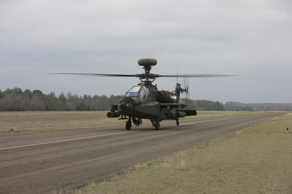 AH-64 Apache helicopter on the runway Canvas Art - Terry MooreStocktrek Images (35 x 23)