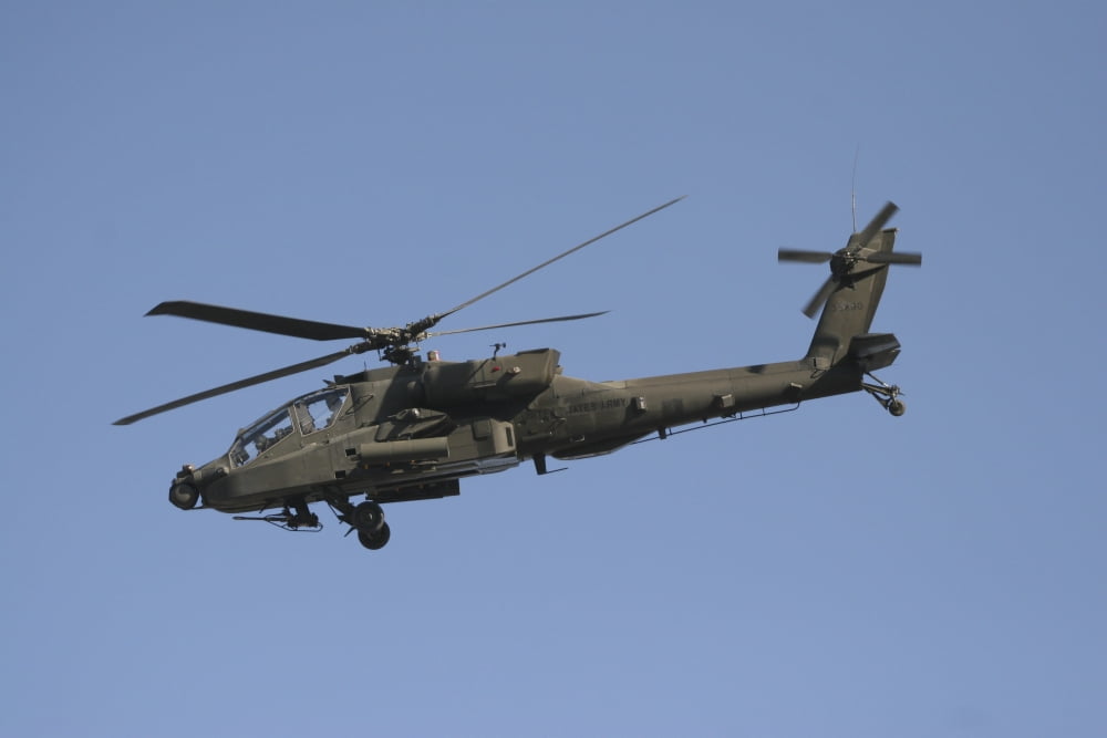 AH-64 Apache in flight over the Baghdad Hotel in central Baghdad Iraq Canvas Art - Terry MooreStocktrek Images (18 x 12)
