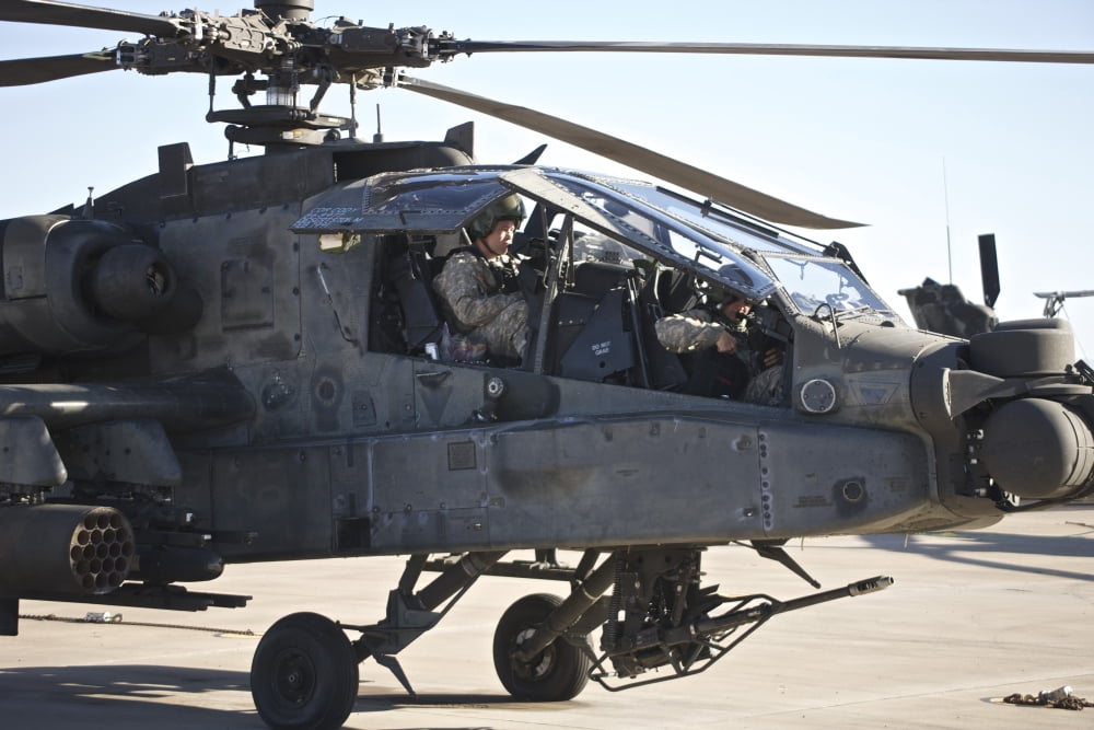 AH-64D Apache Longbow pilot prepares for a mission Canvas Art - Terry MooreStocktrek Images (18 x 12)