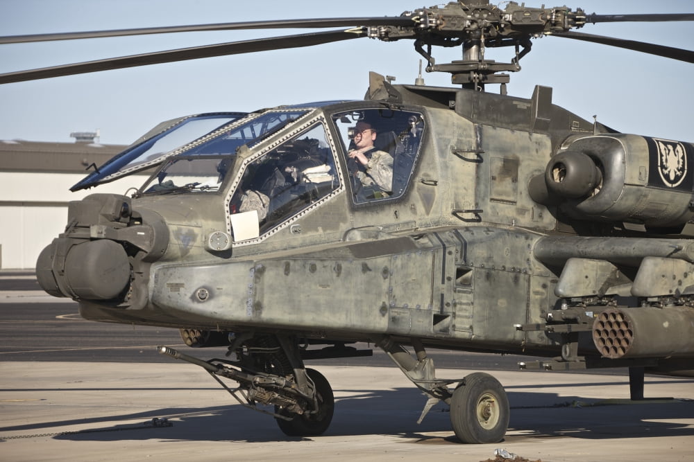 AH-64D Apache Longbow pilot prepares for a mission Canvas Art - Terry MooreStocktrek Images (35 x 23)