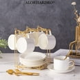 thumbnail image 1 of ALORHARDRO 19 Pcs Porcelain Tea Set, Tea Cups and Saucers, European Ceramic Tea Set, Luxury British Coffee Cup Set - 6 Cups/3.04 fl.oz,6 Saucers,6 Spoons,1 Metal Holder, White, 1 of 9