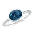 thumbnail image 1 of ANGARA Natural Bezel-Set Oval 1.5 ct London Blue Topaz and Diamond Ring in 14K White Gold for Women (Size-8x6mm) | November Birthstone Jewelry for Women | London Blue Topaz Ring (Ring Size- 8.5), 1 of 10
