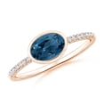 thumbnail image 1 of ANGARA Natural East-West Bezel-Set Oval London Blue Topaz and Diamond Ring in 14K Rose Gold for Women (Size-7x5mm) | November Birthstone Jewelry for Women | London Blue Topaz Ring (Ring Size - 8), 1 of 10