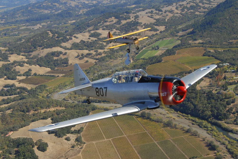 AT-6 Texan and Stearman PT-17 flying over Santa Rosa California Canvas Art - Phil WallickStocktrek Images (34 x 23)