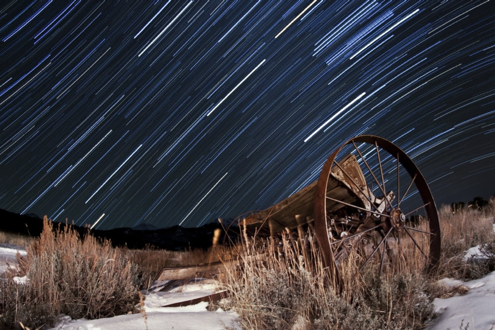 Abandoned farm equipment against a backdrop of star trails Canvas Art - Dan BarrStocktrek Images (35 x 23)