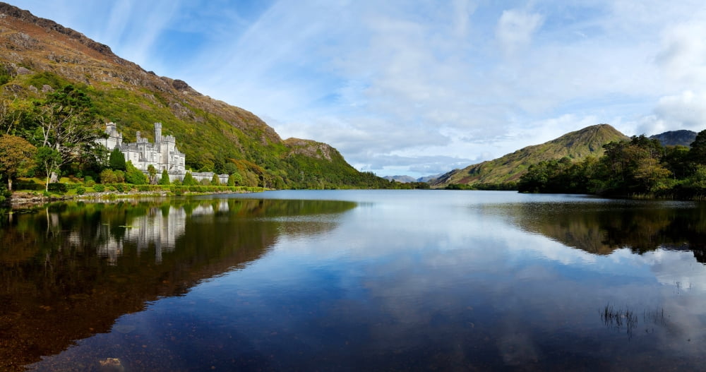 Abbey on the banks of Fannon Pool Kylemore Abbey Connemara County Galway Republic of Ireland Canvas Art - Panoramic Images (27 x 9)