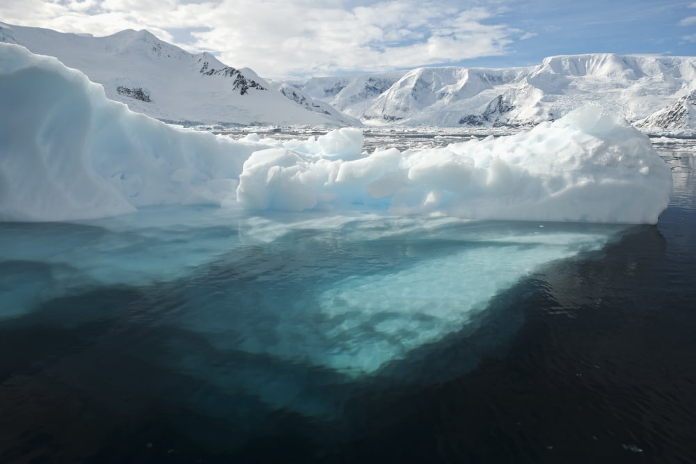 Above and below water view of an iceberg in Neko Harbour Antarctic Peninsula Canvas Art - Daisy Gilardini  Design Pics (19 x 12)