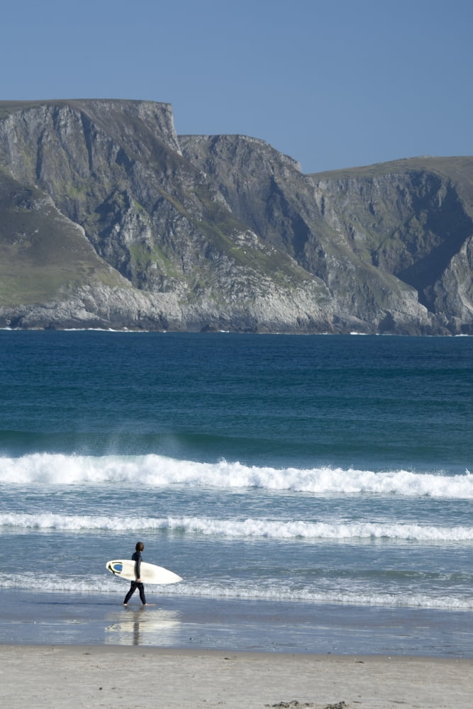 Achill Island Co Mayo Ireland Surfer Walking Along Trawmore Beach Canvas Art - Gareth McCormack  Design Pics (24 x 36)