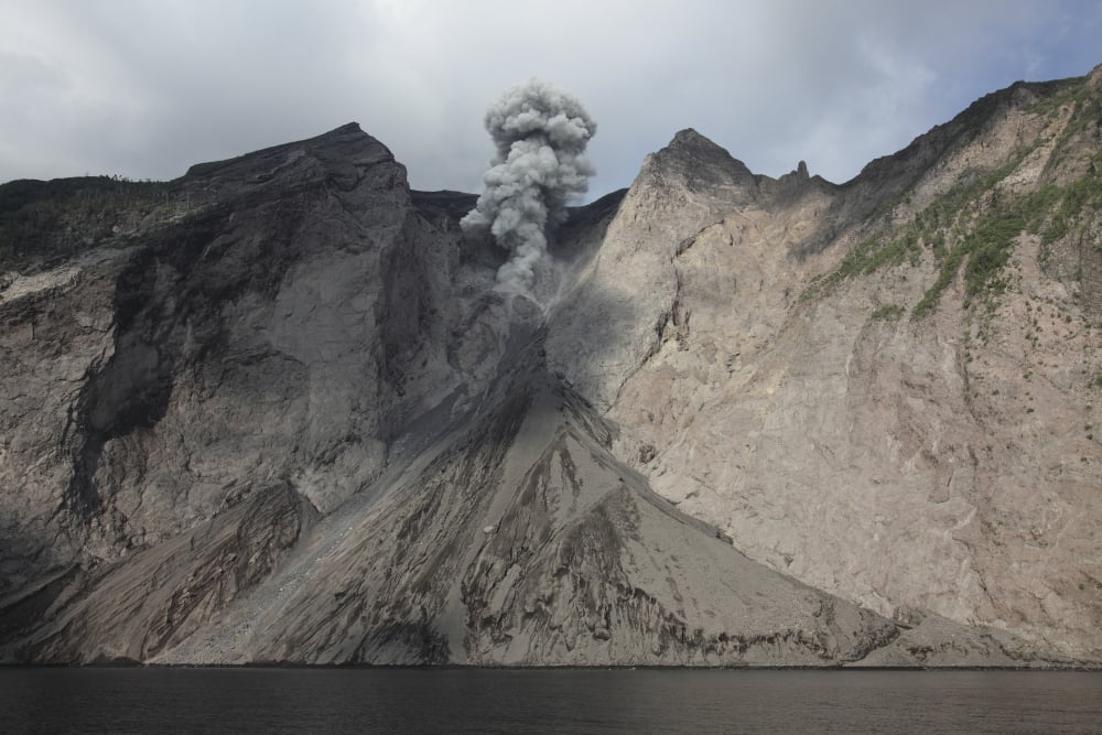 Active crater and debris slope below at Batu Tara volcano Indonesia Canvas Art - Richard RoscoeStocktrek Images (35 x 23)