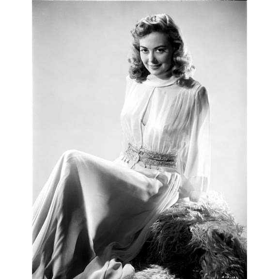 Adele Mara on a Lace Top sitting and smiling Photo Print (8 x 10)