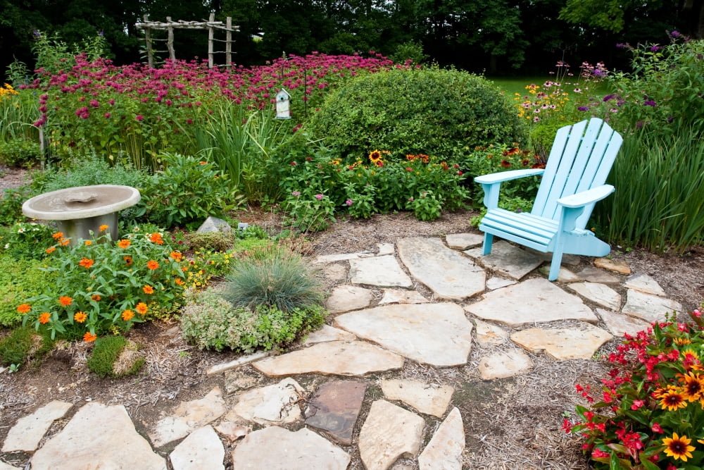 Adirondack chair birdbath and birdhouse in a flower garden Marion County Illinois USA Canvas Art - Panoramic Images (18 x 24)