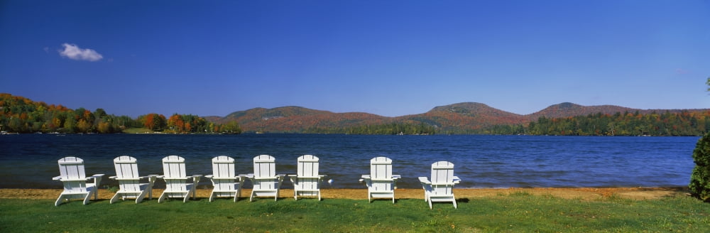 Adirondack chairs at lakeside Blue Mountain Lake Adirondack Mountains New York State USA Canvas Art - Panoramic Images (12 x 36)