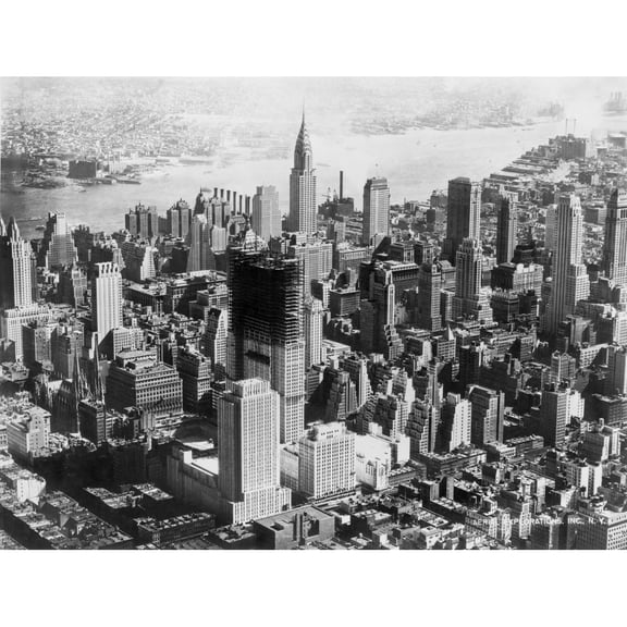 Aerial View Of Mid-Town Manhattan During Construction Of Rockefeller Center. In Center Background Is The Chrysler