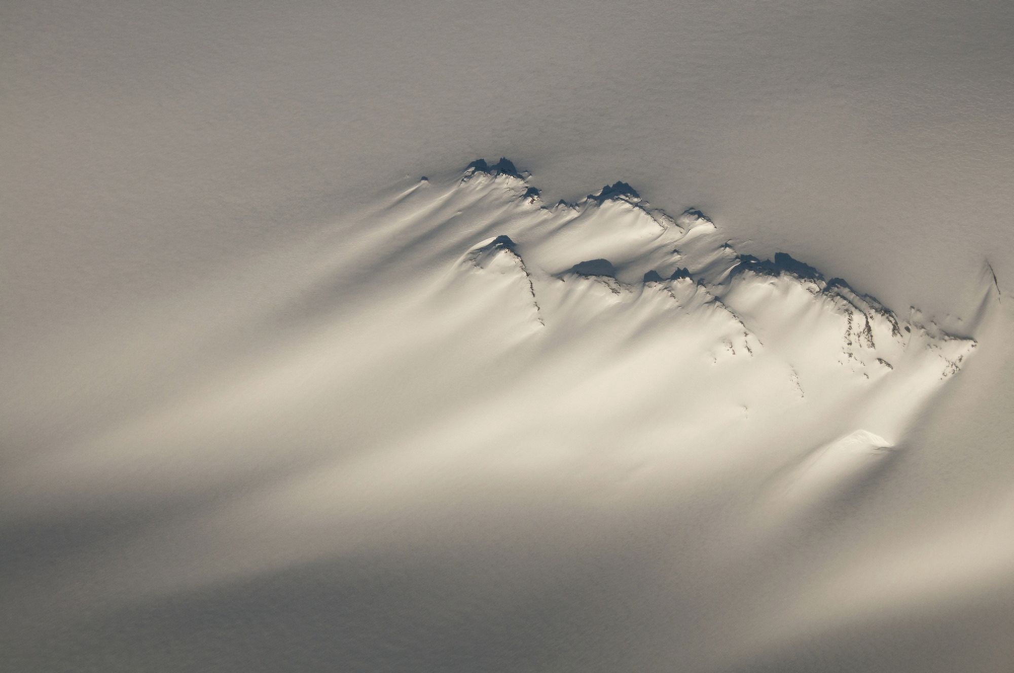 Aerial Of A Windswept Nunatak On The Harding Ice Field In Kenai Fjords National Park Southcentral Alaska Winter Canvas Art - Carl Johnson Design Pics (19 x 12)