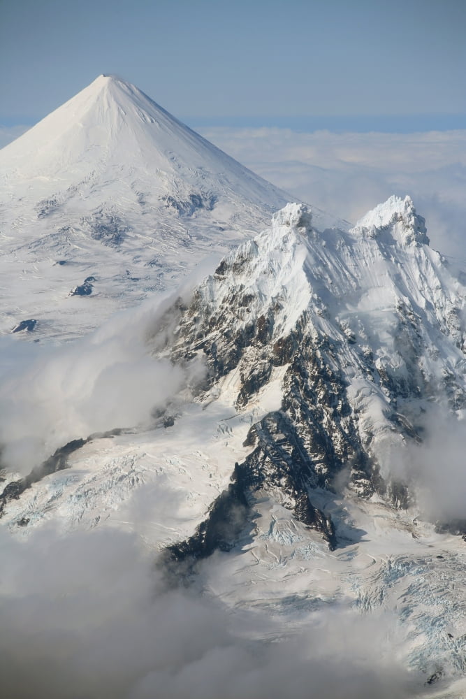 Aerial view of Shishaldin Volcano with Isanotski Peaks in foreground Alaska Canvas Art - Richard RoscoeStocktrek Images (12 x 18)