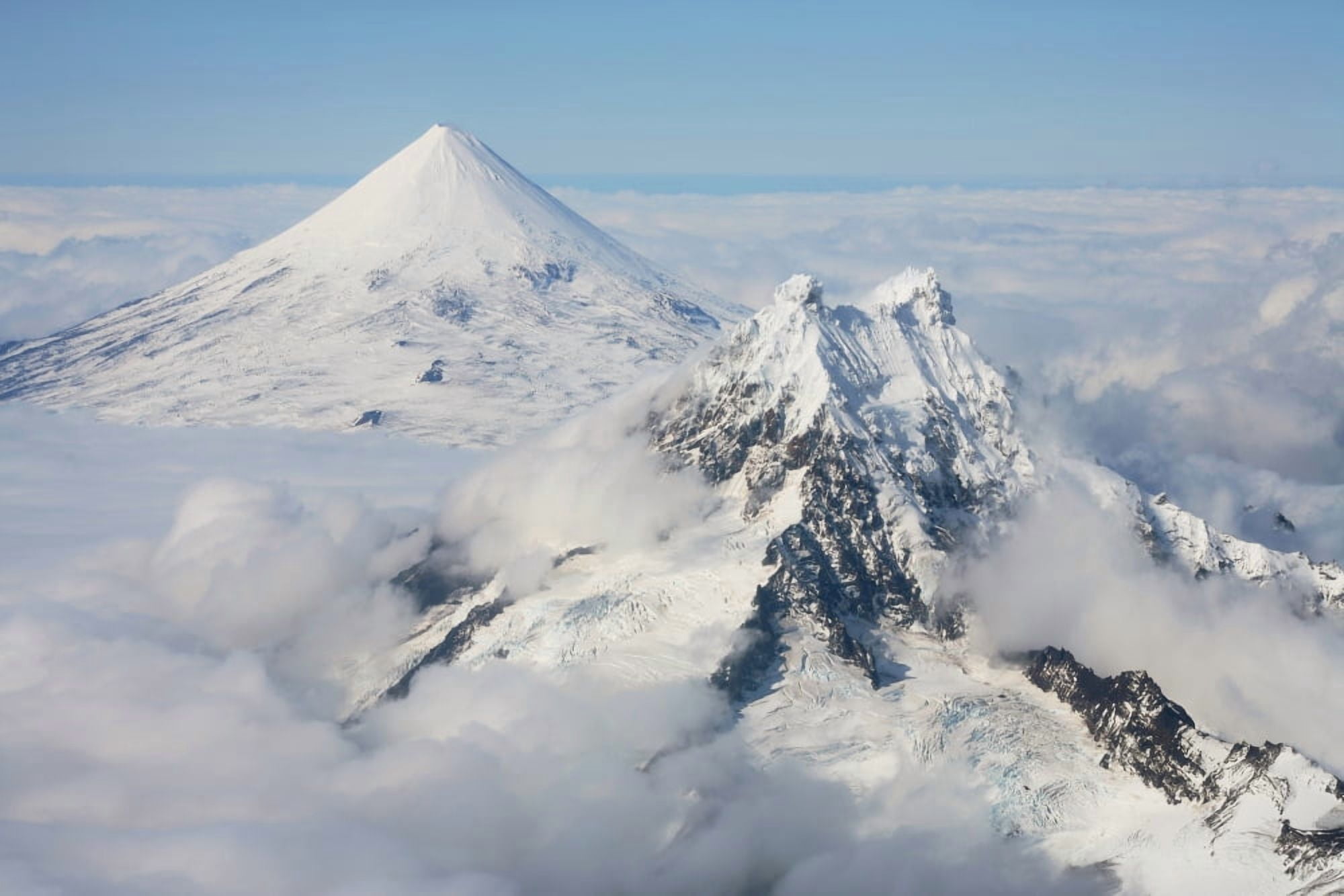 Aerial view of Shishaldin Volcano with Isanotski Peaks in foreground Alaska Canvas Art - Richard RoscoeStocktrek Images (18 x 12)