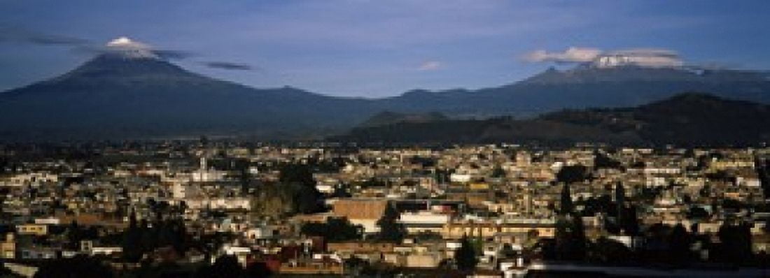 Aerial view of a city a with mountain range in the background Popocatepetl Volcano Cholula Puebla State Mexico Canvas Art - Panoramic Images (18 x 7)