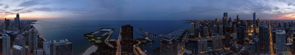 Aerial view of a city at dusk Lake Michigan Chicago Cook County Illinois USA Canvas Art - Panoramic Images (48 x 9)