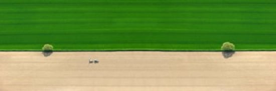 Aerial view of a tractor in field Canvas Art - Panoramic Images (36 x 12)