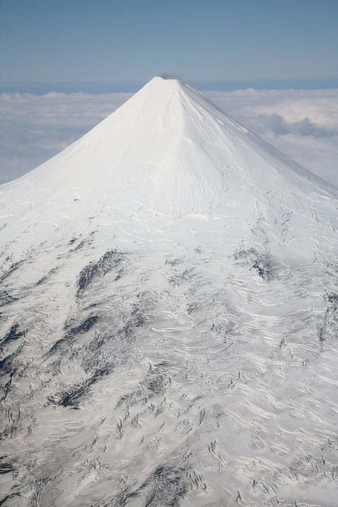 Aerial view of glaciated Shishaldin Volcano Unimak Island Alaska Canvas Art - Richard RoscoeStocktrek Images (12 x 18)