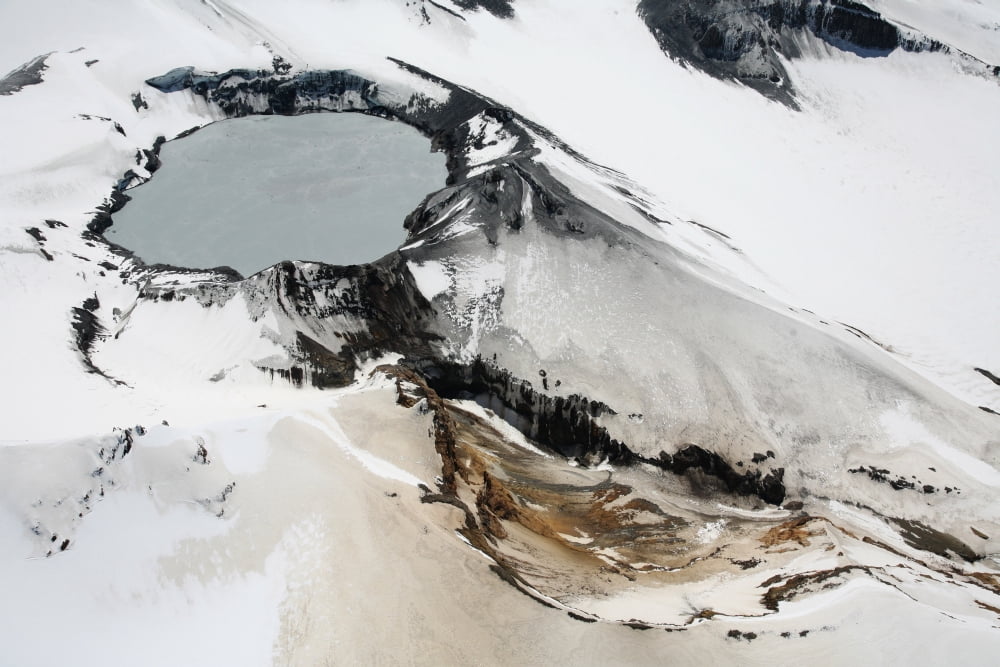 Aerial view of snow-covered Ruapehu volcano summit crater with acidic lake New Zealand Canvas Art - Richard RoscoeStocktrek Images (35 x 23)