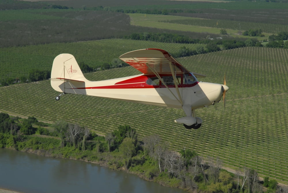 Aeronca Chief flying over Sacramento Valley California Canvas Art - Phil WallickStocktrek Images (17 x 12)