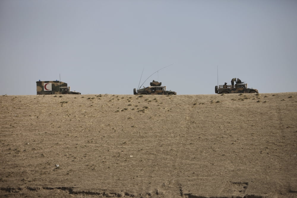 Afghan Army convoy drives along the wadi ridge in Afghanistan Canvas Art - Terry MooreStocktrek Images (18 x 12)