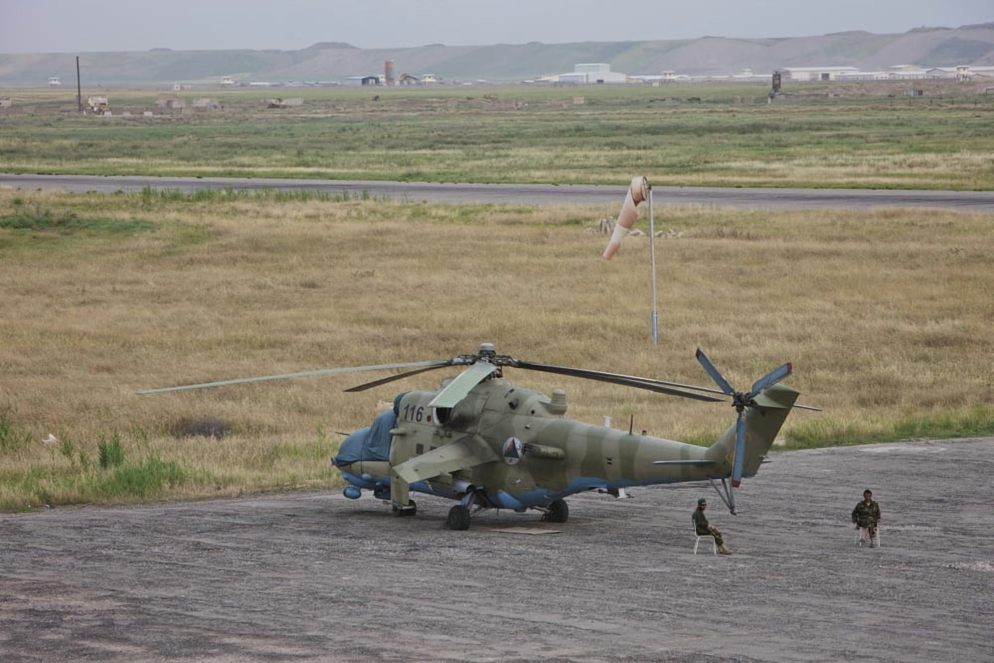 Afghan Army soldiers guard an Mi-35 attack helicopter Canvas Art - Terry MooreStocktrek Images (35 x 24)