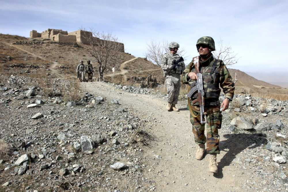 Afghan National Army and US soldiers patrol the village of Akbar Kheyl Afghanistan Canvas Art - Stocktrek Images (34 x 23)