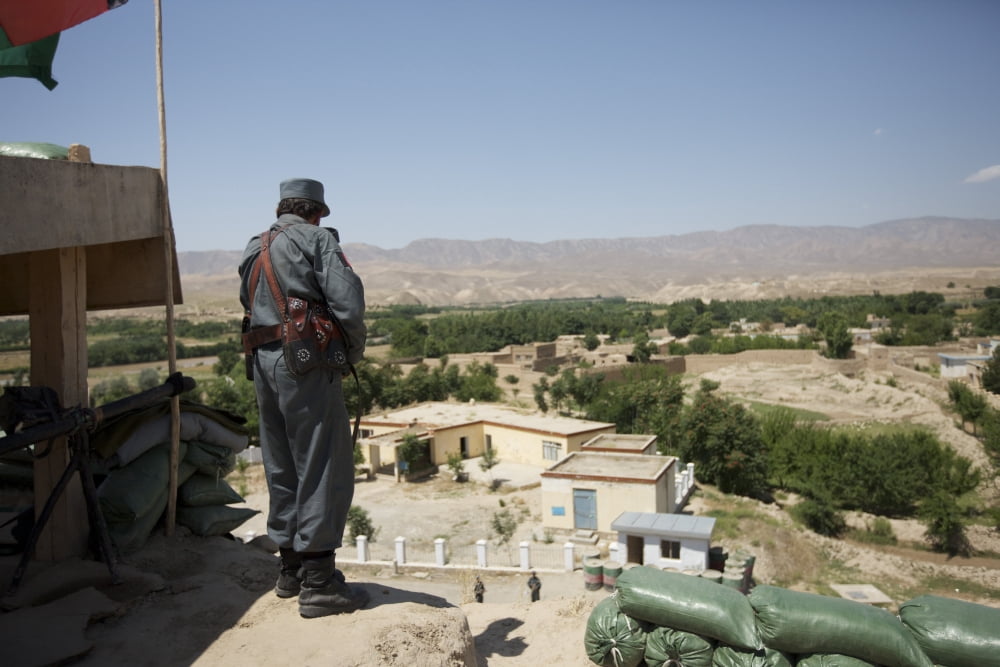 Afghan policeman standing at his checkpoint Canvas Art - Terry MooreStocktrek Images (18 x 12)
